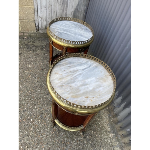 294 - A pair of French gueridon inlaid circular single drawer side tables with brass mounts, brass gallery... 