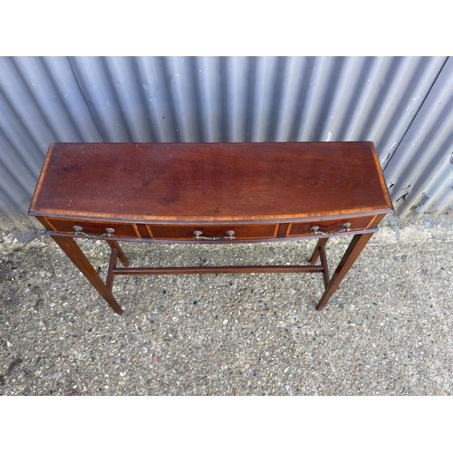 295 - A slim Edwardian mahogany three drawer side table