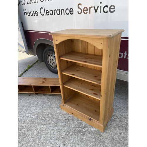 299 - A solid pine bookcase together with a pine wall shelf