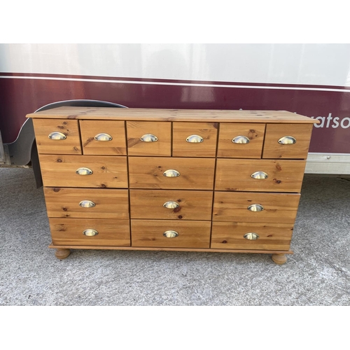 302 - A modern pine bank of 15 drawers 130x 40x 80