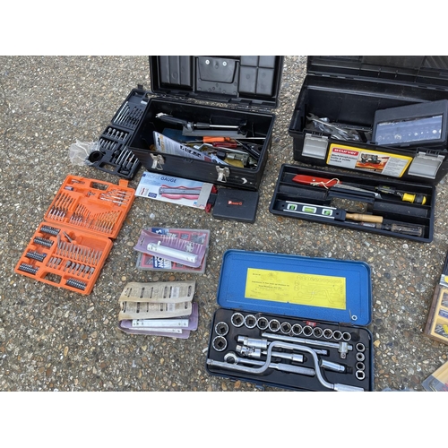 323 - Two tool boxes with contents together with a socket set, drill bit sets and other fixings etc