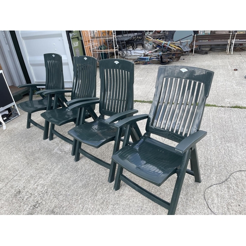 329 - A set of four green plastic garden chairs