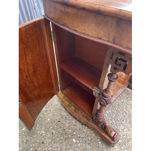 33 - A victorian walnut davenport desk with sliding writing surface and stationary rack top. Doors to eac... 