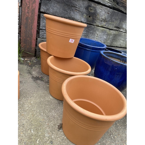 336 - Four new terracotta planters 33round 27 high