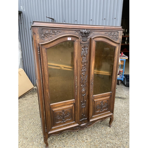 34 - A continental glazed two door bookcase 120x34x 165