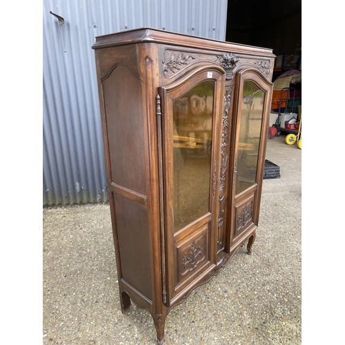 34 - A continental glazed two door bookcase 120x34x 165