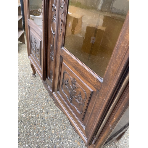 34 - A continental glazed two door bookcase 120x34x 165