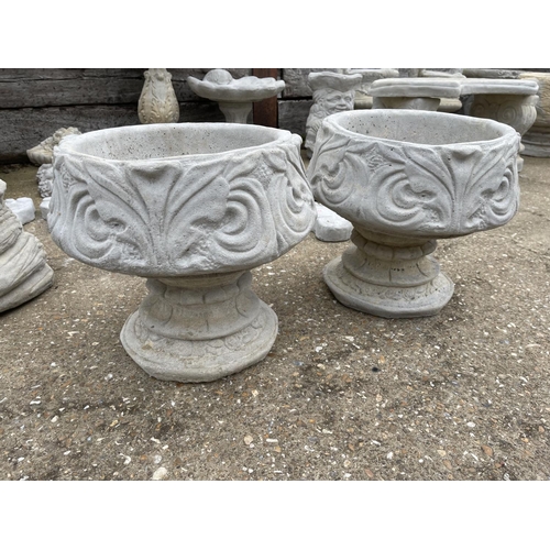 343 - A pair of large cast concrete pedestal urns