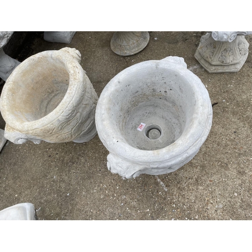 354 - A pair of concrete textured Acanthus pattern garden urns