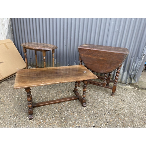 36 - A reproduction oak coffee table, oval occasional table and a gate leg table