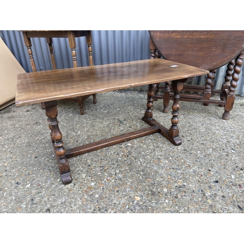 36 - A reproduction oak coffee table, oval occasional table and a gate leg table