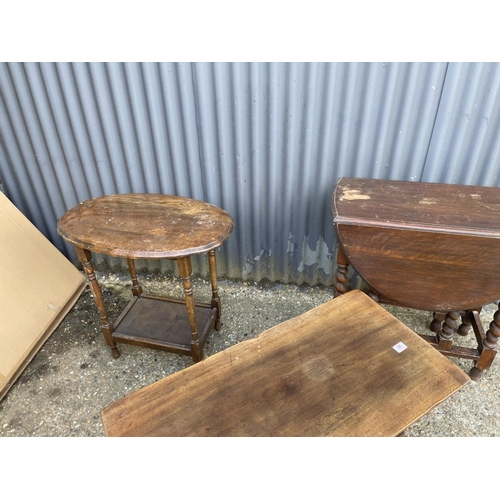 36 - A reproduction oak coffee table, oval occasional table and a gate leg table