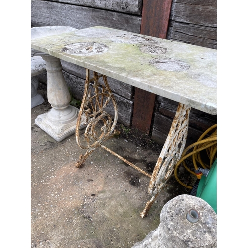 361 - A cast iron garden table with white marble top