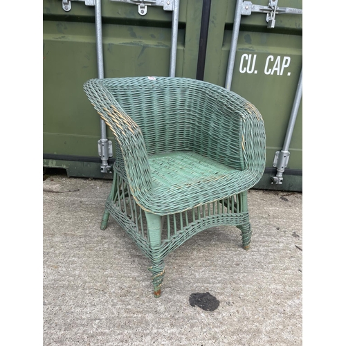 376 - A retro green painted wicker chair