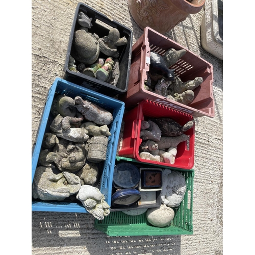 381m - Five crates of small concrete animals and figures