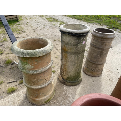 392 - Three chimney pots larger 70cm