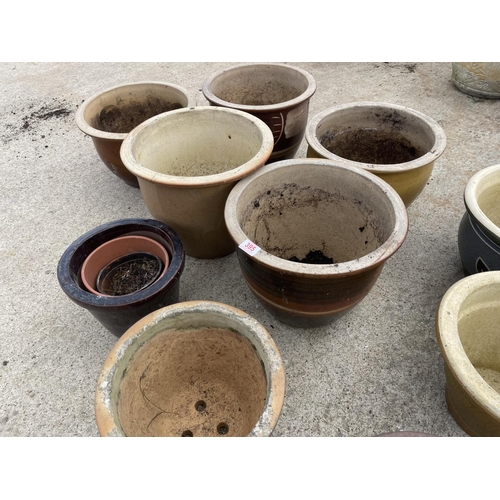 395 - A collection of 11 glazed garden pots