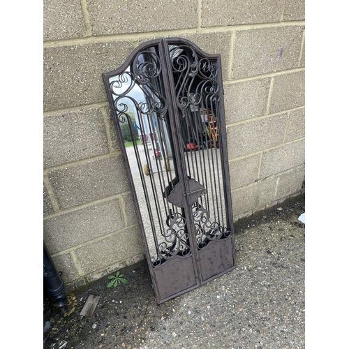 41 - An iron framed garden shutter mirror 128cm tall