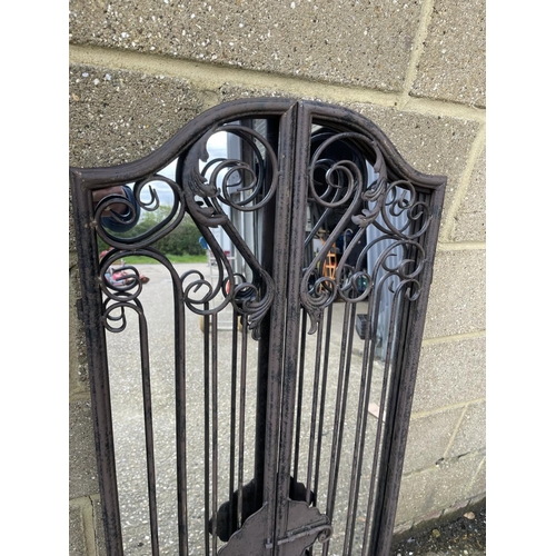 41 - An iron framed garden shutter mirror 128cm tall