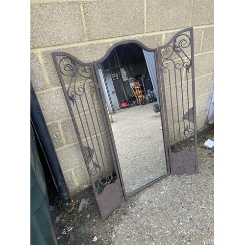 41 - An iron framed garden shutter mirror 128cm tall