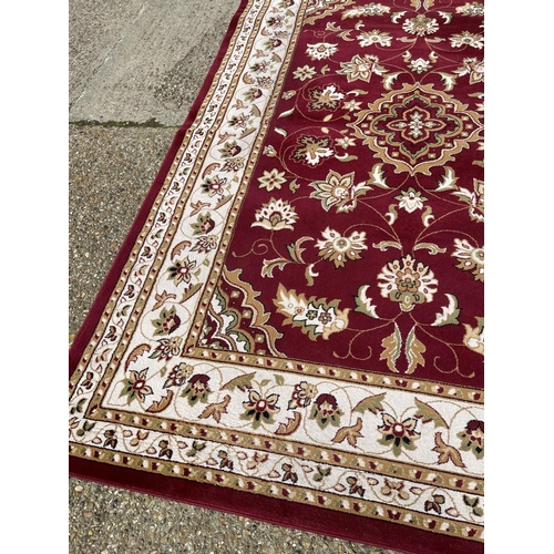 43 - A good quality red pattern carpet 290x200