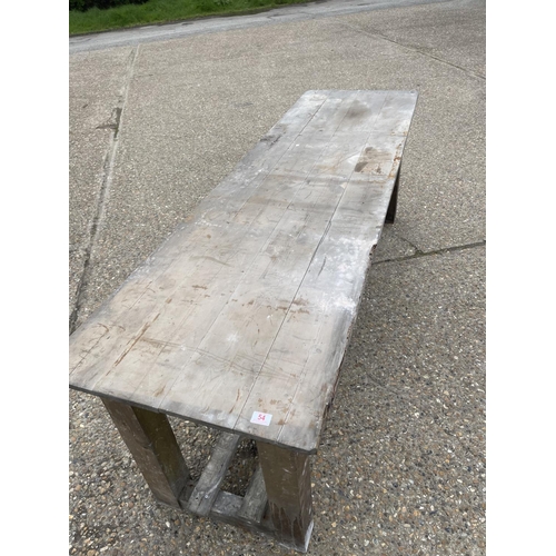 54 - A long antique pine laundry table  233x68x80