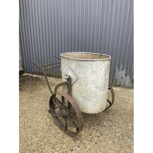 6 - A vintage iron water carrier with galvanised drum