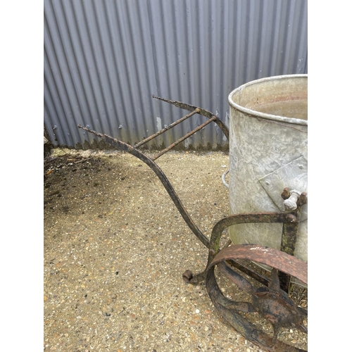 6 - A vintage iron water carrier with galvanised drum