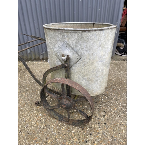 6 - A vintage iron water carrier with galvanised drum