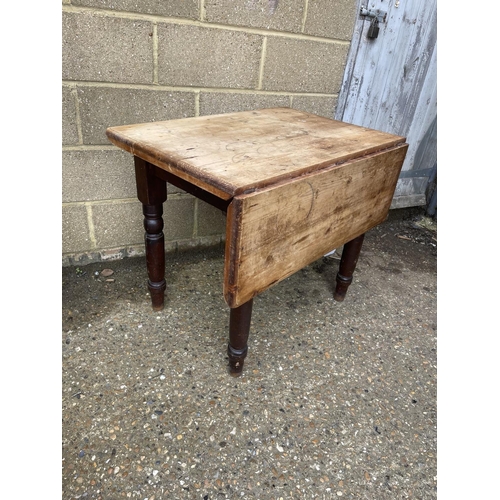 71 - A country pine drop leaf table