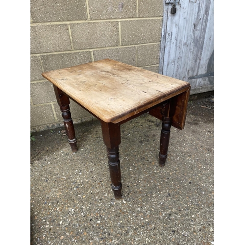 71 - A country pine drop leaf table