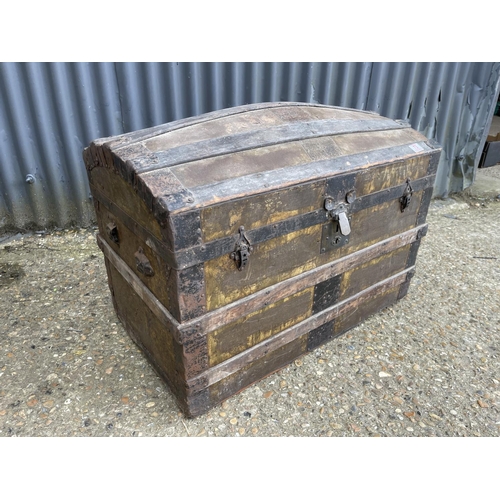 73 - A vintage domed top trunk