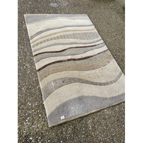 84 - A modern green pattern rug from John Lewis 120x180. Design Alum Bay Sand.