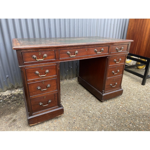 86 - A mahogany twin pedestal desk with green leather top  166x50x77