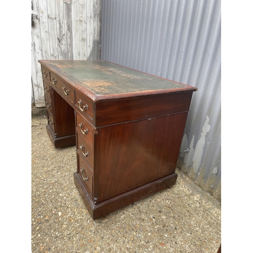 86 - A mahogany twin pedestal desk with green leather top  166x50x77