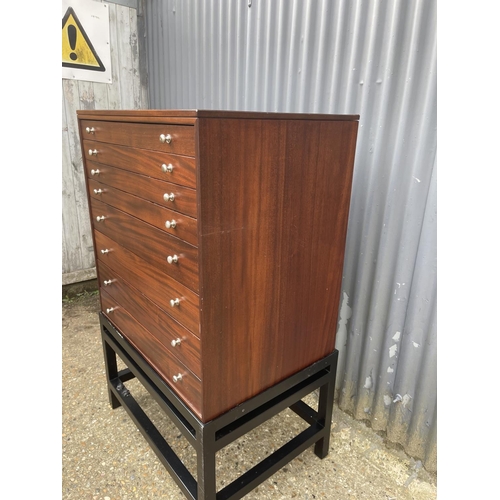 87 - A hardwood eight drawer collectors chest of drawers on stand, each drawer lined with green baize 77x... 