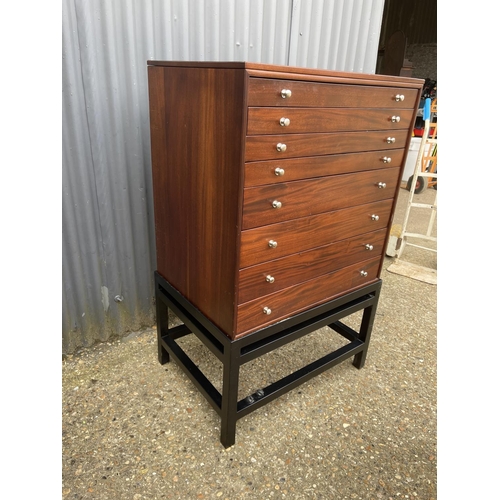 87 - A hardwood eight drawer collectors chest of drawers on stand, each drawer lined with green baize 77x... 