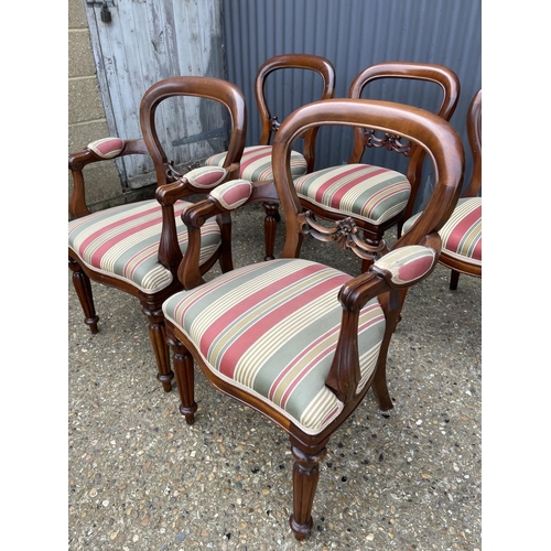 89 - A set of five reproduction mahogany balloon back chairs (inc. 2 carvers)