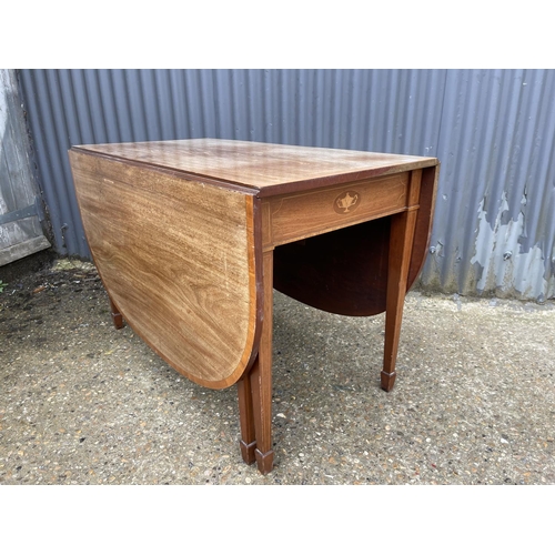 9 - An Edwardian mahogany inlaid gate leg table