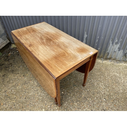 9 - An Edwardian mahogany inlaid gate leg table