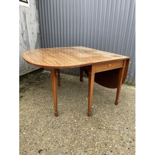 9 - An Edwardian mahogany inlaid gate leg table