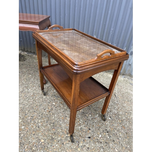 90 - A walnut tray top trolley together with a hardwood side table