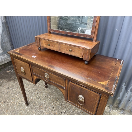 94 - A Georgian mahogany three drawer table together with a swing mirror AF