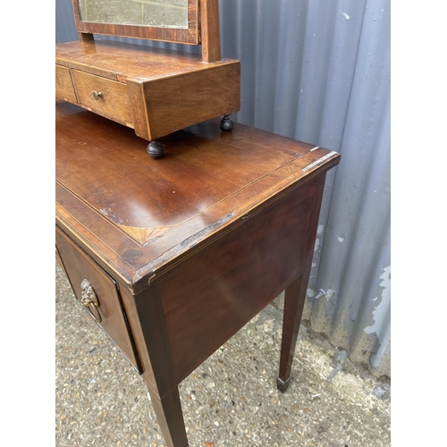 94 - A Georgian mahogany three drawer table together with a swing mirror AF