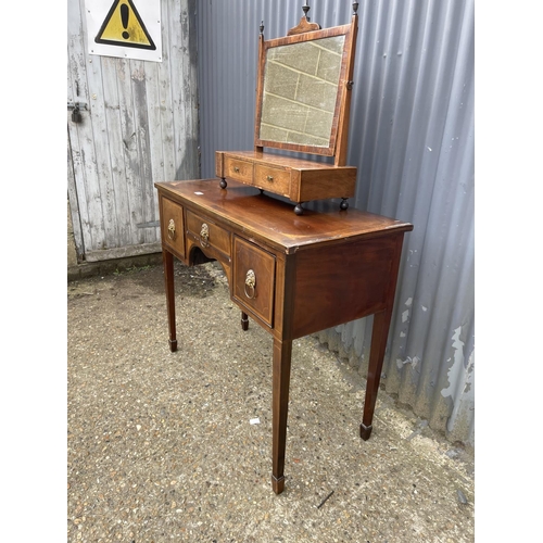 94 - A Georgian mahogany three drawer table together with a swing mirror AF