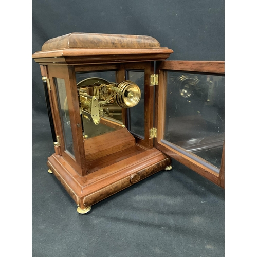 729 - Modern Burr Walnut cased striking Table Clock height 34 cms