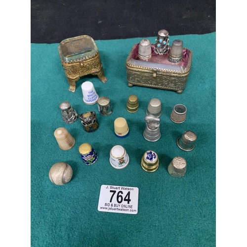 764 - Two Victorian trinket boxes, three Silver thimbles, fifteen others and miniature tennis ball