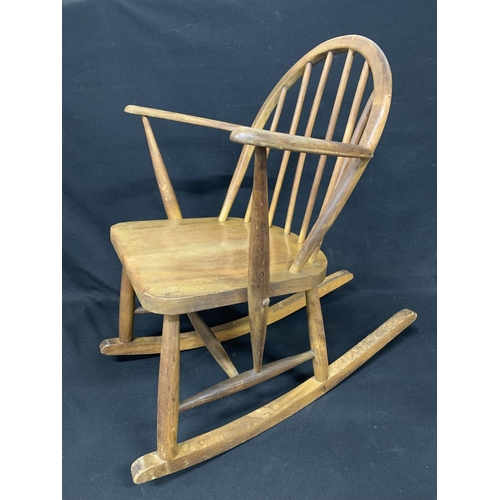 835 - Vintage Ercol utility stamped rocking chair, height 74cms width 60 cms