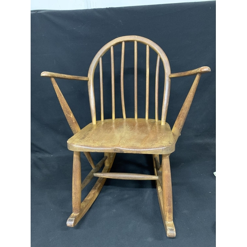 835 - Vintage Ercol utility stamped rocking chair, height 74cms width 60 cms