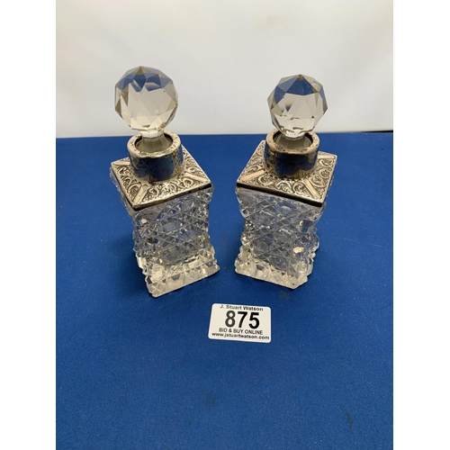 875 - Pair of Hallmarked Silver mounted scent bottles (one with chip to bottle)